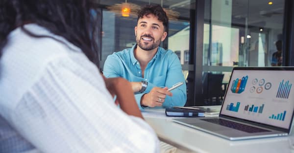 two colleagues having discussion in office setting